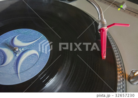 Playing vinyl on turntable Playing vinyl on turntable 32657230