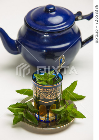 Traditional Arab mint tea, white background Traditional Arab mint tea, white background 32658386