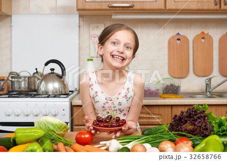 girl cooking in home kitchen fruit and vegetables 32658766