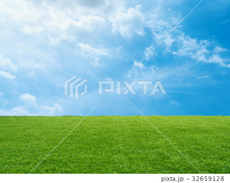 green grass on blue sky background green grass on blue sky background 32659128