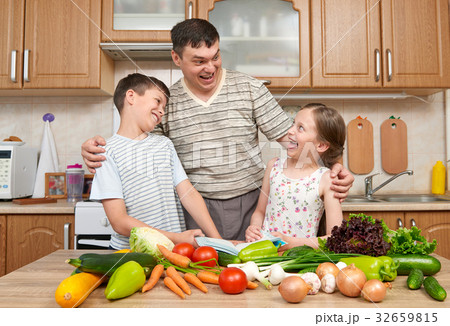Father and  children having fun in kitchen room 32659815