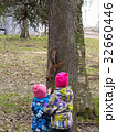 children feeding a squirrel 32660446