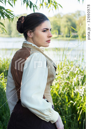 Woman on the river bank 32660978