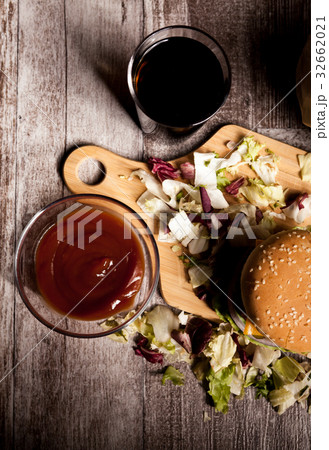 Home made burgers on wooden plate 32662021