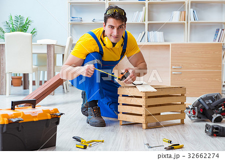 Repairman carpenter working with wooden board Repairman carpenter working with wooden board 32662274
