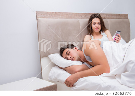 Wife reading his husbands text sms messages Wife reading his husbands text sms messages 32662770