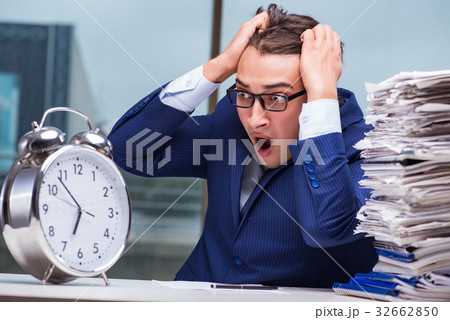 Businessman with pile stack of paper paperwork and Businessman with pile stack of paper paperwork and 32662850