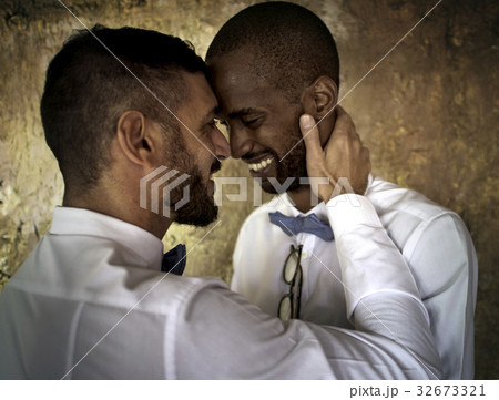 Closeup of Gay Couple Smiling Together 32673321