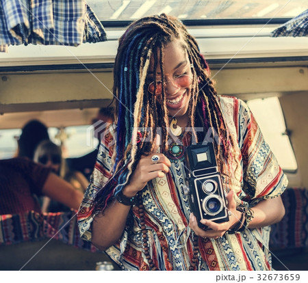 Woman Sitting with Camera Taking Snap Shoot Photo in a Van Woman Sitting with Camera Taking Snap Shoot Photo in a Van 32673659
