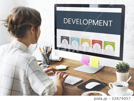Woman using working on computer screen on wooden table 32674057