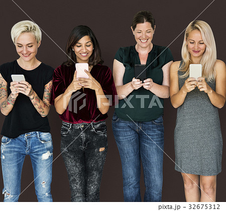 Group of friends are using smart phone and smiling 32675312
