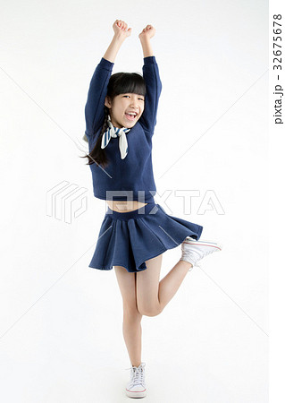 Happy little Asian child smiling and dancing Happy little Asian child smiling and dancing 32675678