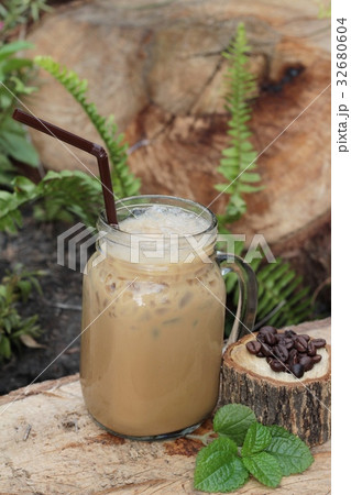 Iced coffee is delicious on wood background. 32680604