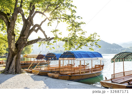 Boats at the shore of Bled Lake in Slovenia Boats at the shore of Bled Lake in Slovenia 32687171