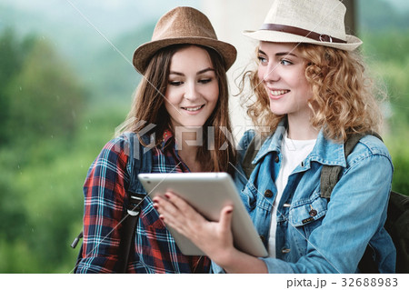 Two girls in hats traveling through ruins Two girls in hats traveling through ruins 32688983