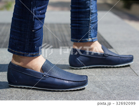 A man in blue moccasins A man in blue moccasins 32692099
