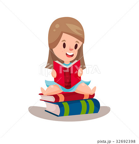Sweet girl reading a book sitting on a pile of Sweet girl reading a book sitting on a pile of 32692398