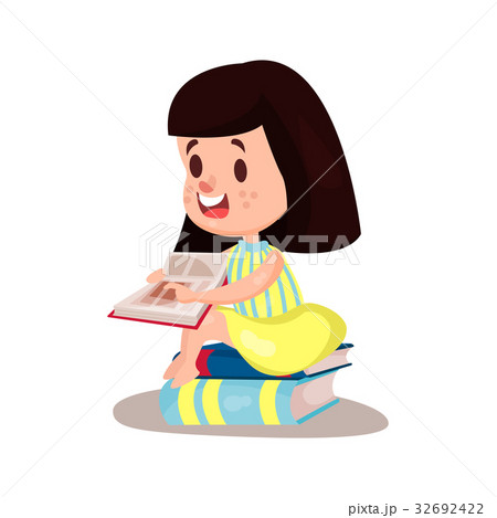 Sweet brunette girl reading a book sitting on a Sweet brunette girl reading a book sitting on a 32692422