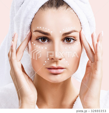 Young sensual woman with cream dots on face. Young sensual woman with cream dots on face. 32693353