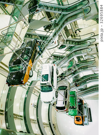 Many cars suspended on a steel cable. 32695884