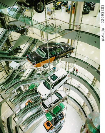 Many cars suspended on a steel cable. 32695885