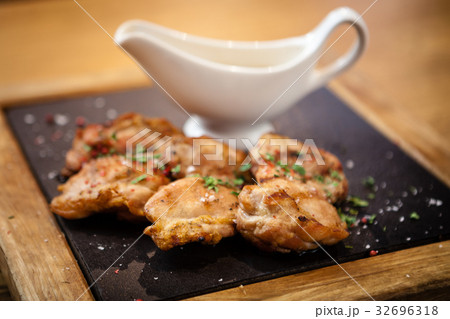 Chicken thighs with sauce Chicken thighs with sauce 32696318