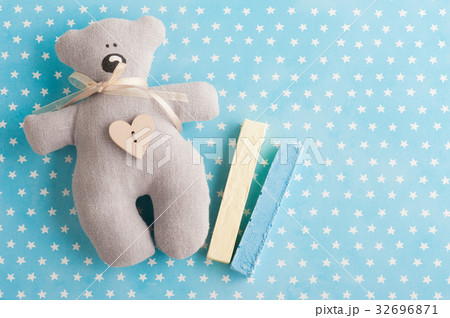 Blue white stars background with teddy bear 32696871