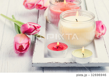 Yellow and pink aroma candles with tulips Yellow and pink aroma candles with tulips 32696946