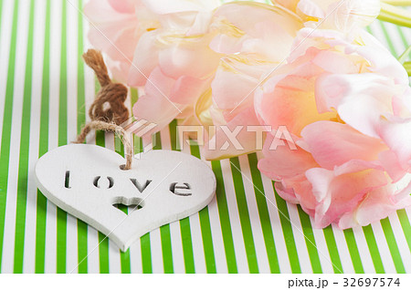 Pink tulips and wooden heart 32697574