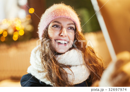 Young woman using tablet computer on the street 32697974