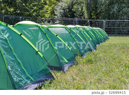 Row of camping tents on campground. Row of camping tents on campground. 32699415