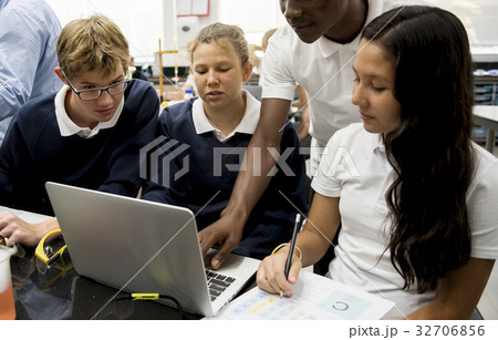 Group of diverse high school students studying in class 32706856