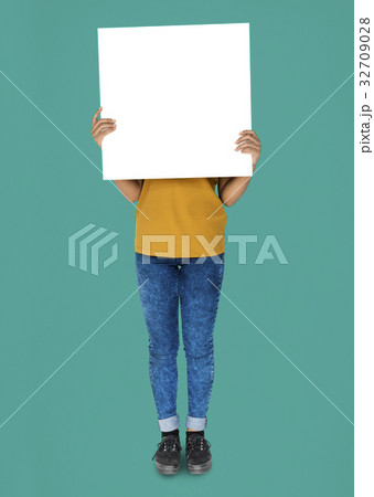 Covered Face Girl Standing and Holding Empty Placard 32709028