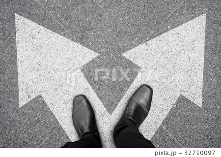 Businessman making decision at the crossroad Businessman making decision at the crossroad 32710097