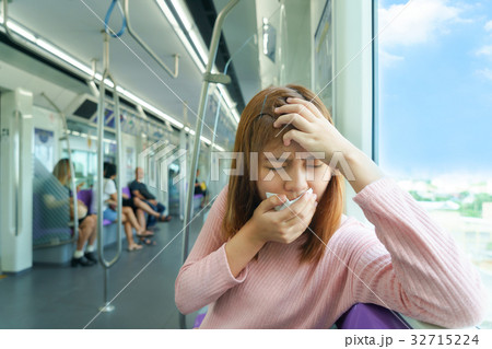 woman headache or carsick while taking sky train woman headache or carsick while taking sky train 32715224