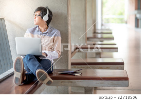Young Asian student man using laptop in college 32718506