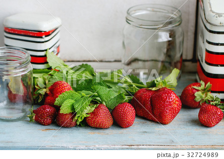 Fresh strawberries and melissa herbs Fresh strawberries and melissa herbs 32724989