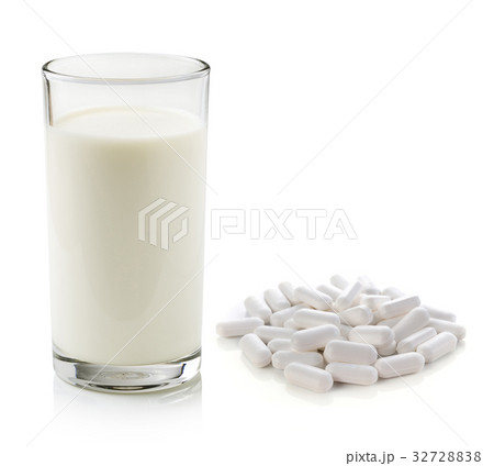 pill and glass of milk isolated on white pill and glass of milk isolated on white 32728838