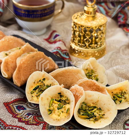 Arabic kataif pancakes with cream and pistachio Arabic kataif pancakes with cream and pistachio 32729712