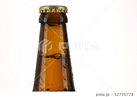 Bottle of beer with drops. Close up. White Bottle of beer with drops. Close up. White 32730778