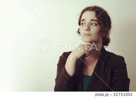 young thoughtful woman pensive wondering looking young thoughtful woman pensive wondering looking 32731002