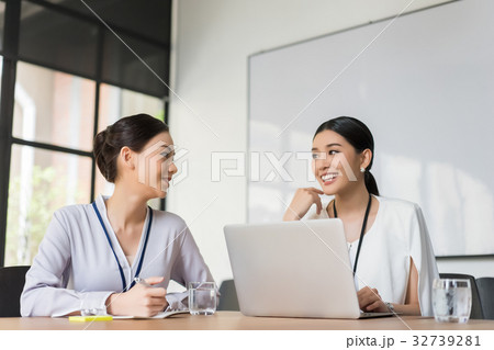 two office workers are having a discussion indoors 32739281