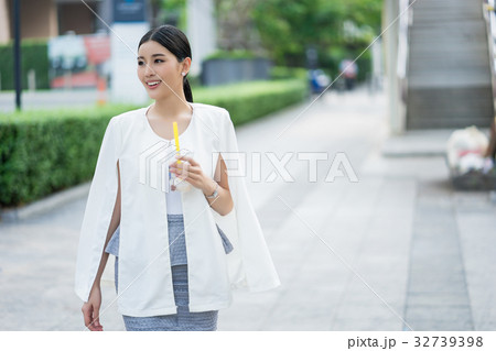 a picture of girl standing along the pathway 32739398