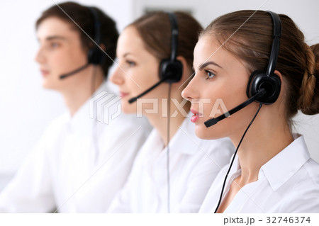Call center. Focus on beautiful woman in headset 32746374