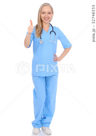 Smiling young nurse showing thumbs up sign 32746555