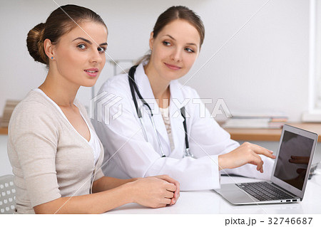 Doctor and  patient  sitting at the desk. Physici 32746687