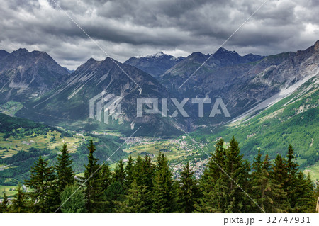 Bormio city and Dolomites top view, stormy clouds 32747931