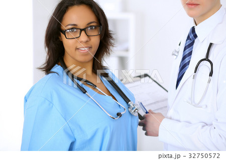 Female african american medical doctor with Female african american medical doctor with 32750572