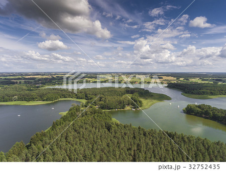 Aerial view of green islands on the lake in Poland Aerial view of green islands on the lake in Poland 32752435
