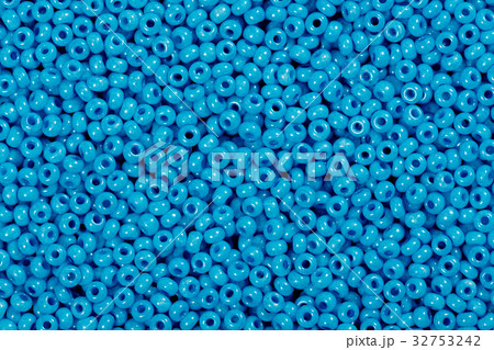 Multicolored blue glass seed beads background. Multicolored blue glass seed beads background. 32753242